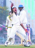 Kamal Passi of Punjab celebrates after taking a wicket in the Cooch Behar U-19 semifinal match in Mohali 