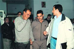 A police party with Gajender (left) in Ambala before he was brought to Panchkula