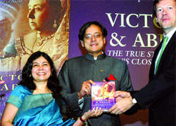 Shashi Tharoor, minister of state for external affairs, releases Shrabani Basus (left) book ' Victoria & Abdul (Story of the Queen's Closest Confidant) in New Delhi on Monday.