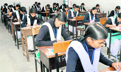    Students take Uttarakhand Pre-Board examinations at Government Girls Inter College, Dehradun. 