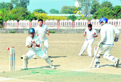  Contender team tries to run out the batsman at the District Cricket League in Dehradun on Monday.