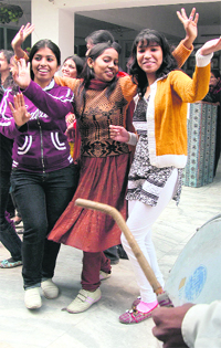 Students of Eros Polytechnic dance to the tunes of Dhol ahead of Lohri  in Faridabad on Monday.