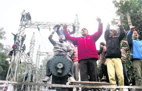 Daily wage workers of the PDD protest in Jammu on Monday