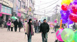 People enjoy their evening at the Sarabha Nagar market in Ludhiana.