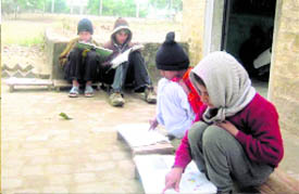 Students of Government Elementary School, Baliyon, near Machhiwara, sit on the floor in the open as the school lacks basic infrastructure.