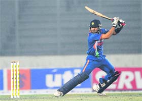 Virat Kohli plays a shot during his unbeaten knock of 102 in Dhaka