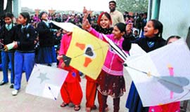 We want to fly like kites: Girls of Rashtriya Bal Shiksha Kendra try their hands at kite flying during Lohri celebrations in Amritsar.