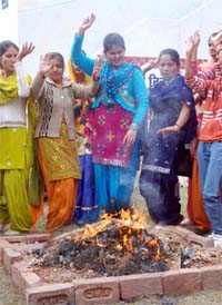 Sunder Mundriye, Ho!: Students of Swami Vivekananda Girls College dance around a bonfire to celebrate Lohri in Bathinda