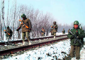 In view of the reports that militants are waiting across the border to sneak in, security has been tightened in the terror-hit state. CRPF soldiers patrol the area around the railway track in Anantnag, using a deep search metal detector