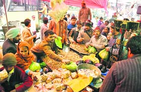 People buy peanuts, gachak and popcorns on the eve of Lohri in Ludhiana