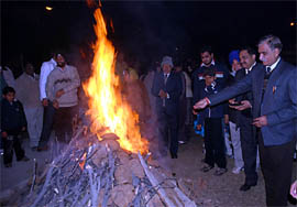 Residents of the Green Avenue colony, opposite Rose Garden, celebrating Lohri in Bathinda on Wednesday.
