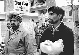 A relative of the child, who allegedly died after being vaccinated in a health centre at Matuor village in Mohali on Wednesday.