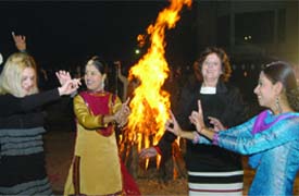 Tourists and traditional dancers celebrate the festival at Hotel Lalit in New Delhi