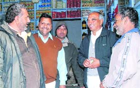 Congress candidate BS Beniwal (left) and MLA Sampat Singh campaigns in Ellenabad
