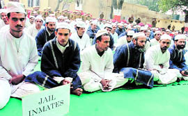 Inmates of Amphalla jail enjoy a musical programme organised in connection with Lohri in Jammu on Wednesday