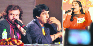 Hans Raj Hans and Ashok Masti, judges, and (right) a girl performs during the Awaaz Punjab Di audition in Ludhiana on Wednesday.