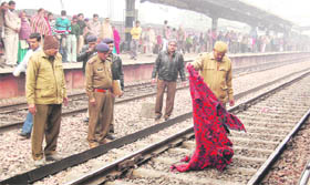 Railway police personnel inspect the mishap site at New Town Railway Station, Faridabad, on Wednesday.