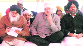 Parkash Singh Badal, Rajinder Bhandari, president, Punjab BJP, and Sukhbir Singh Badal at a political conference of the SAD at the Maghi mela in Muktsar on Wednesday.