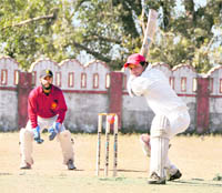 A batsman plays a shot at the 58th District Cricket League at Survey Stadium in Dehradun on Thursday.