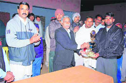 Social activist Ved Prakash Arya honours a sportsman at Jakhala village in Rewari