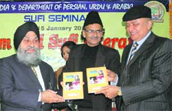 Punjabi University Vice-Chancellor Dr Jaspal Singh (left) releases a book on Sufism and Sufi literature in Patiala