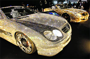 Customised Mercedes-Benz SL600s and Luxury Crystal Benz, studded with 3,00,000 Swarovski crystal glass, are displayed at the pavilion of custom car accessory company Garson/D.A.D. at Tokyo Auto Salon 2010, at Makuhari Messe in Tokyo on Friday. 