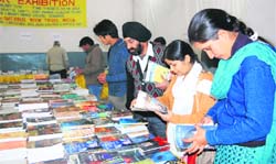Readers on a buying spree on the last day of a book fair organised by the National Book Trust in Dehradun