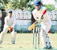 A batsman faces a delivery at the 58th District Cricket League in Dehradun 