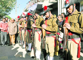 The guard of honour being accorded to Swami Mohan Chaitainya in Dehradun on Friday
