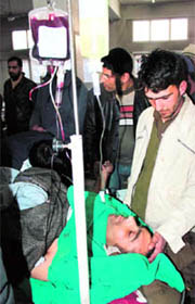 A policeman, who was injured in a militant attack in Sopore, being treated at a hospital in Srinagar on Friday.