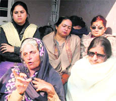 Raj Kumari, mother of Rajnish Sharma who was allegedly killed in police custody, narrates the incident at her residence in Jammu on Friday.