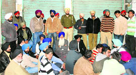SAD leaders stage a dharna following a property dispute in Ludhiana on Friday.