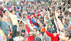 Street vendors hold a protest at D-zone office of the municipal corporation in Ludhiana on Friday.