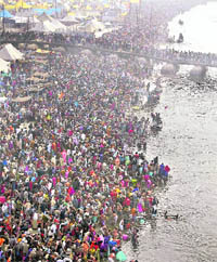 Devotees take a holy dip in the Ganga in Allahabad on Friday.