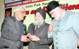 Rajya Sabha member and Editor-in-Chief of The Tribune HK Dua (left) with Dargah Sharif Khadim-e-Khwaja Syed Sarwar Chishti (right) @@and VC of Punjabi University Dr Jaspal Singh during a seminar at the university in Patiala on Friday.