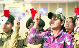 Cadets of the NCC observe the solar eclipse during a Republic Day rehearsal in Jalandhar on Friday.