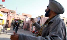 A cop flying kite during free time in Bathinda