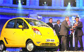 Minister of State for Road, Transport and Highways R P N Singh presents the Car of the Year award for Tata Nano to Ratan Tata in Mumbai on Friday night.