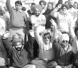 Residents of Factory Area block road in protest against Fish Market in Patiala on Saturday.
