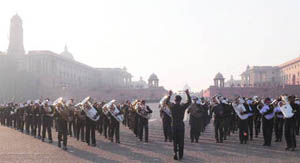 Service bands perform during the rehearsal for the Beating Retreat ceremony at Vijay Chowk in New Delhi on Saturday.