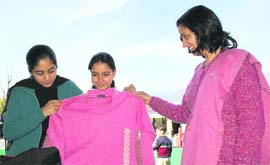 Visitors at an handloom exhibition at the police grounds in Dharamsala on Saturday.