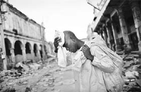 A man walks through a destroyed street after Tuesdays earthquake in Port-au-Prince