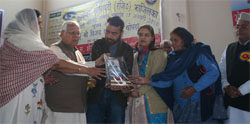 Guests honouring the kin of eye donors at a programme organised by the NGO, Social Welfare Society, in Fazilka on Sunday