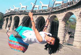 FREEDOM UNLIMITED: A girl enjoys a swing at the Rock Garden in Chandigarh