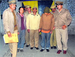 The rape accused being escorted by police personnel in Dharamsala on Sunday.