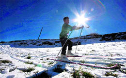 A boy enjoys skiing in Kufri, near Shimla.