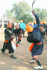 Youths play gatka during a programme organised by the Dashmesh Akhara Gatka Party in Jammu on Sunday.