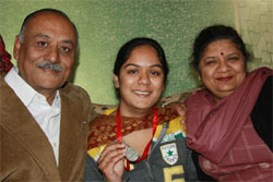 Ankita Sehgal flanked by her parents.