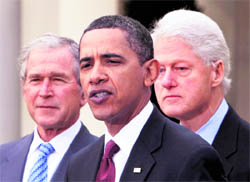 US President Barack Obama (centre) speaks as former presidents George W Bush (left) and Bill Clinton listen at the White House in Washington on Saturday. Obama asked the former presidents to help with US relief efforts in Haiti after the earthquake