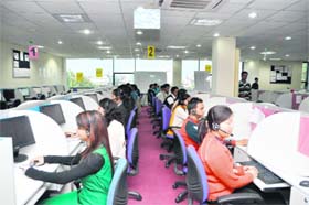 Workers at the Spanco BPO centre that opened in Dehradun